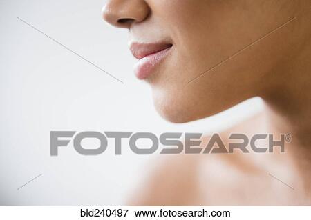 Close up of mouth of Mixed Race woman with bare shoulders View Large Photo Image Stock Photo - Close up of mouth of Mixed Race woman with bare shoulders. Fotosearch