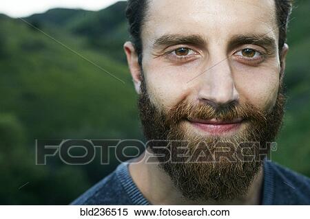 Stock Photography - Close up of smiling Mixed Race man with beard. Fotosearch