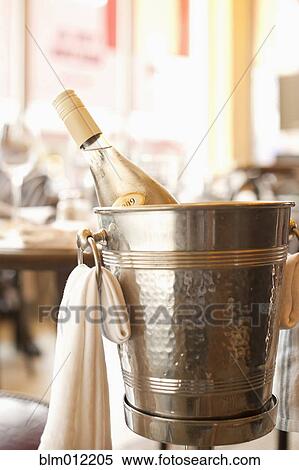 Close up of white wine in ice bucket View Large Photo Image Stock Photography - Close up of white wine in ice bucket. Fotosearch
