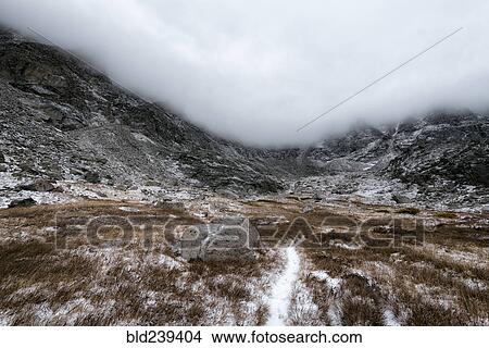 Clouds over rocky landscape View Large Photo Image Picture - Clouds over rocky landscape. Fotosearch