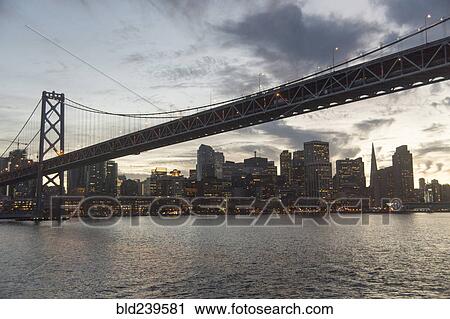 Clouds over urban bridge at waterfront View Large Photo Image Stock Image - Clouds over urban bridge at waterfront. Fotosearch