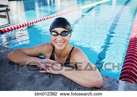 Stock Image - Competitive swimmer in swimming pool. Fotosearch