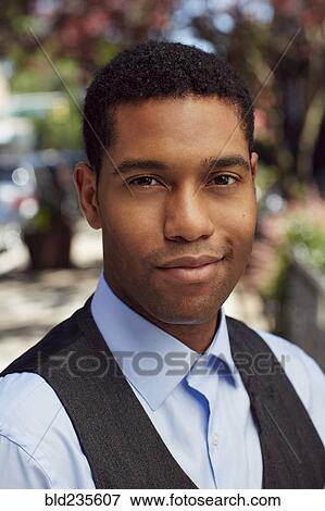 Confident man wearing vest outdoors View Large Photo Image Stock Photo - Confident man wearing vest outdoors. Fotosearch