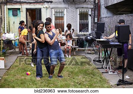 Couple dancing at backyard party View Large Photo Image Stock Image - Couple dancing at backyard party. Fotosearch