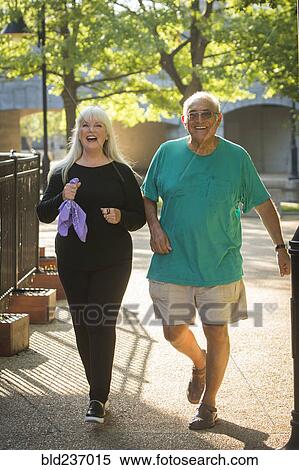 Stock Photography - Couple walking in park. Fotosearch