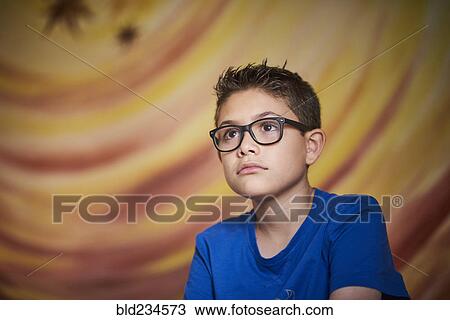Curious Hispanic boy looking away View Large Photo Image Stock Image - Curious Hispanic boy looking away. Fotosearch