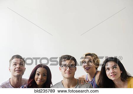 Curious people looking up View Large Photo Image Stock Photo - Curious people looking up. Fotosearch