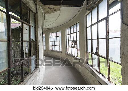 Curving walkway in dilapidated building View Large Photo Image Stock Photography - Curving walkway in dilapidated building. Fotosearch