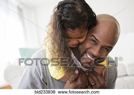 Daughter hugging father View Large Photo Image Stock Photo - Daughter hugging father. Fotosearch