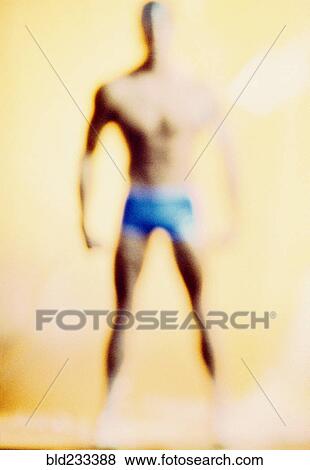 Stock Photo - Defocused man standing in underwear. Fotosearch