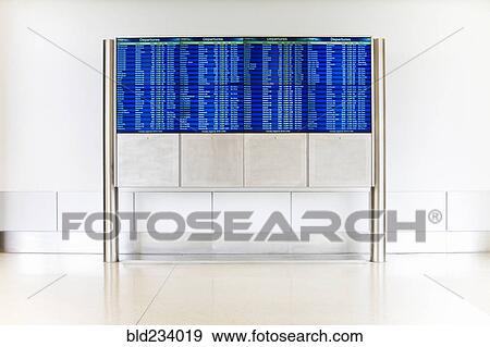Departure schedule at airport View Large Photo Image Stock Photo - Departure schedule at airport. Fotosearch