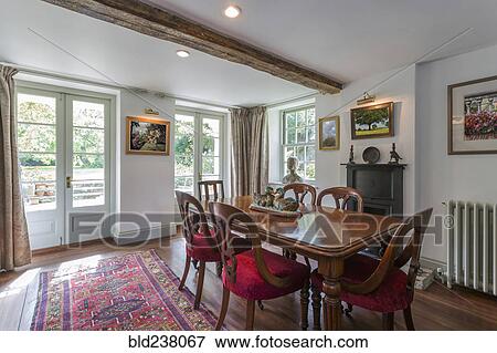 Dining table in sunny room View Large Photo Image Stock Photo - Dining table in sunny room. Fotosearch