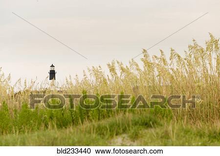 "Distant lighthouse, Tybee, Georgia, United States" View Large Photo Image Stock Image - "Distant lighthouse, Tybee, Georgia, United States". Fotosearch
