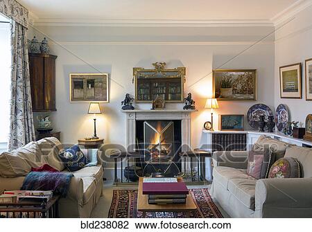 Stock Image - Domestic livingroom with fireplace. Fotosearch