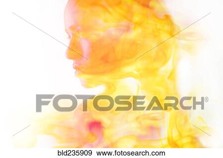 Stock Photo - Double exposure of face of Mixed Race woman and fire. Fotosearch