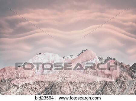 Stock Image - Double exposure of Mixed Race girl laying on mountain landscape. Fotosearch
