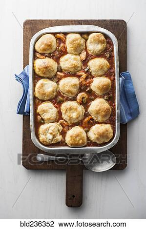 Dumplings gumbo in pan on cutting board View Large Photo Image Stock Image - Dumplings gumbo in pan on cutting board. Fotosearch