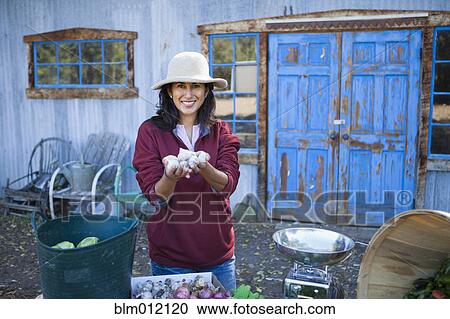 Ecuadorian woman gardening View Large Photo Image Stock Image - Ecuadorian woman gardening. Fotosearch
