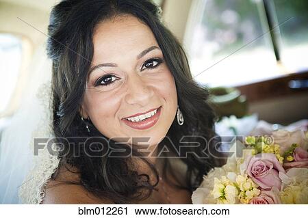 Stock Image - Egyptian bride holding bouquet. Fotosearch