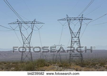 Electricity pylons in landscape View Large Photo Image Stock Image - Electricity pylons in landscape. Fotosearch