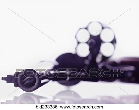 Stock Photograph - Empty open revolver cylinder. Fotosearch
