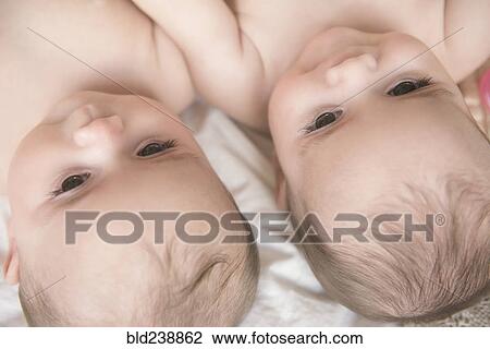 Faces of Caucasian twin baby girls View Large Photo Image Stock Image - Faces of Caucasian twin baby girls. Fotosearch