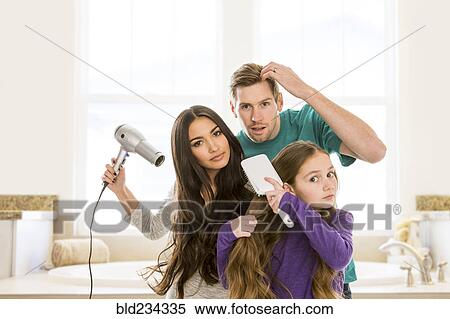 Family grooming hair in bathroom View Large Photo Image Stock Photography - Family grooming hair in bathroom. Fotosearch