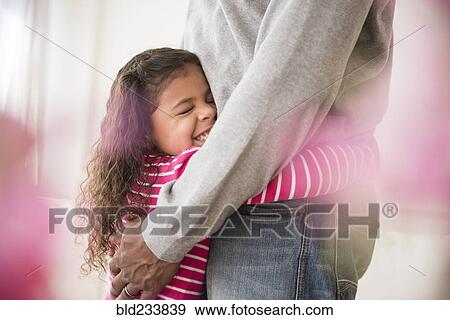 Stock Photo - Father and daughter hugging. Fotosearch