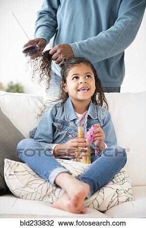 Father brushing hair of daughter View Large Photo Image Stock Image - Father brushing hair of daughter. Fotosearch