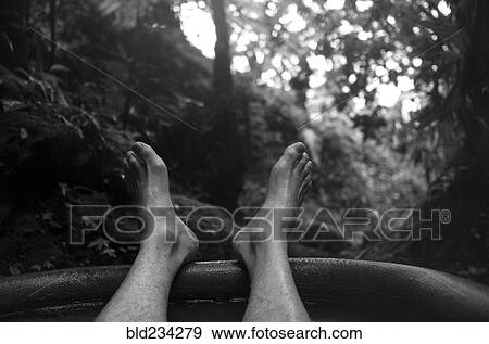 Feet of man soaking in tub outdoors View Large Photo Image Stock Photo - Feet of man soaking in tub outdoors. Fotosearch