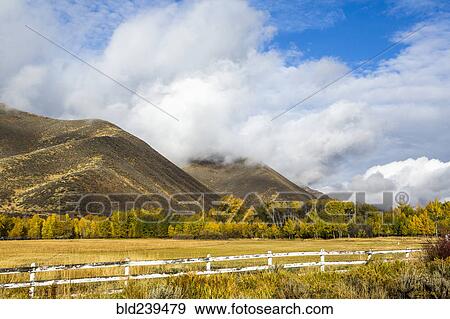 Fence and mountain under clouds View Large Photo Image Stock Photo - Fence and mountain under clouds. Fotosearch