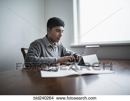 Fiji Indian boy using digital tablet View Large Photo Image Picture - Fiji Indian boy using digital tablet. Fotosearch