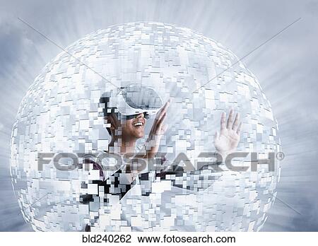 Stock Image - Fiji Indian boy wearing virtual reality goggles in floating sphere. Fotosearch