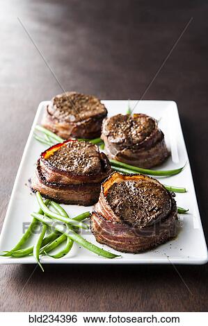 Filet mignon wrapped in bacon View Large Photo Image Stock Photograph - Filet mignon wrapped in bacon. Fotosearch
