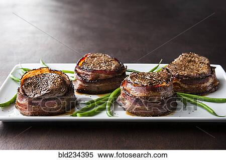 Filet mignon wrapped in bacon View Large Photo Image Stock Photography - Filet mignon wrapped in bacon. Fotosearch
