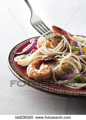 Fork twirling spaghetti with shrimp View Large Photo Image Stock Image - Fork twirling spaghetti with shrimp. Fotosearch