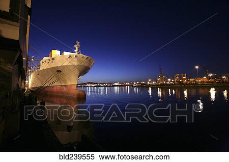 Freighter in port at night View Large Photo Image Stock Photography - Freighter in port at night. Fotosearch