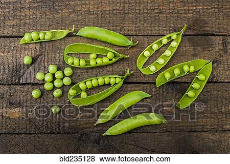 Fresh peas on wooden table View Large Photo Image Stock Photo - Fresh peas on wooden table. Fotosearch