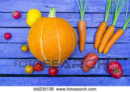 Fresh vegetables on purple wooden table View Large Photo Image Stock Photograph - Fresh vegetables on purple wooden table. Fotosearch