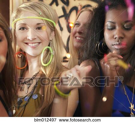 Stock Photo - Friends dancing at party. Fotosearch