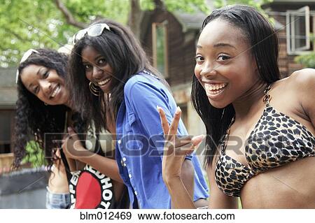 Friends hanging out together outdoors View Large Photo Image Stock Photo - Friends hanging out together outdoors. Fotosearch