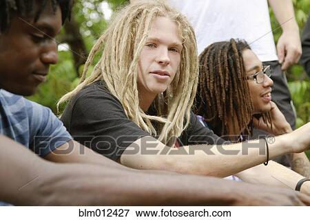 Friends hanging out together View Large Photo Image Stock Photo - Friends hanging out together. Fotosearch