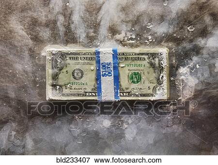 Frozen bundle of dollar bills View Large Photo Image Stock Photo - Frozen bundle of dollar bills. Fotosearch