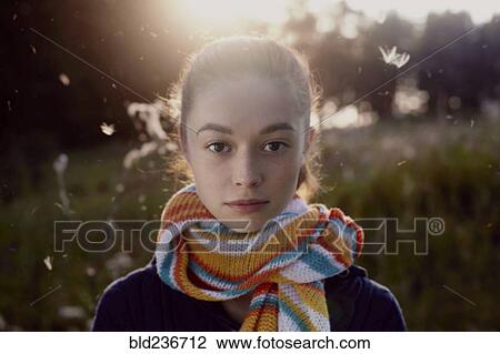 Fuzz floating near face of serious Caucasian girl in forest View Large Photo Image Stock Image - Fuzz floating near face of serious Caucasian girl in forest. Fotosearch
