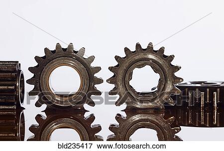 Gears in puddle of oil View Large Photo Image Stock Photo - Gears in puddle of oil. Fotosearch