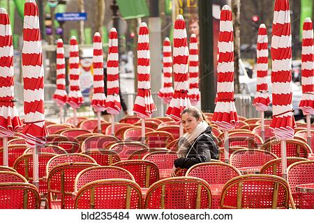 Girl sitting in red chair looking over shoulder View Large Photo Image Picture - Girl sitting in red chair looking over shoulder. Fotosearch