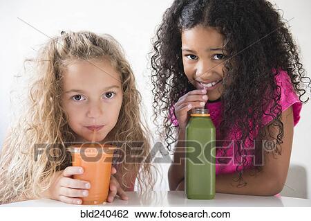 Girls drinking healthy smoothies View Large Photo Image Stock Image - Girls drinking healthy smoothies. Fotosearch