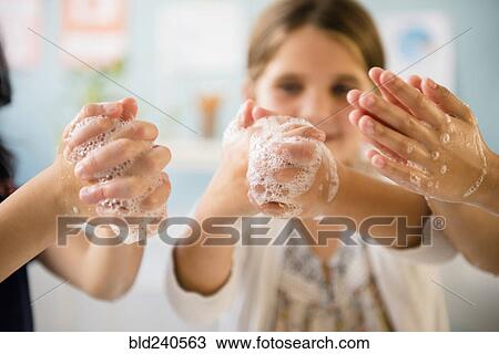 Girls washing hands with soap View Large Photo Image Stock Image - Girls washing hands with soap. Fotosearch