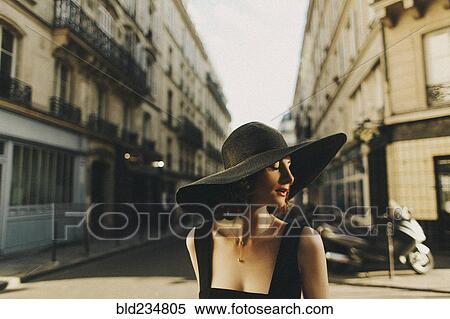 Glamorous Caucasian woman standing in city street View Large Photo Image Stock Photography - Glamorous Caucasian woman standing in city street. Fotosearch