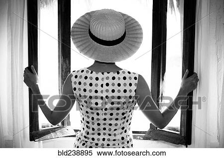 Glamorous woman opening windows View Large Photo Image Stock Photography - Glamorous woman opening windows. Fotosearch